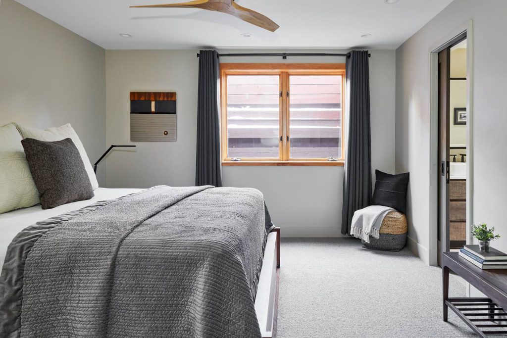 A luxury gray bedroom with an attached bathroom