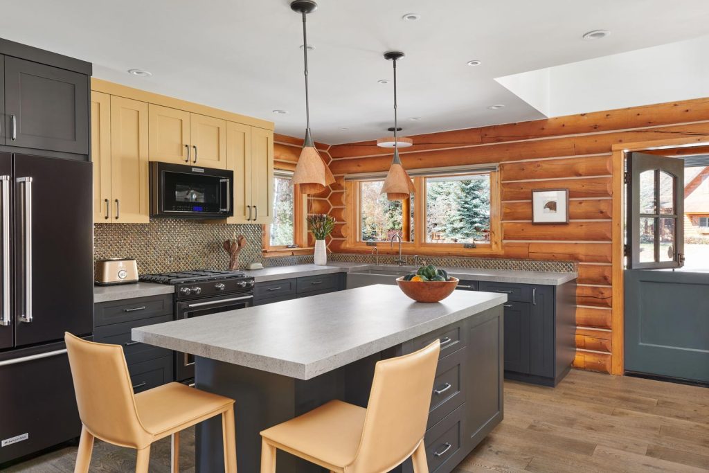 A log cabin kitchen with a Dutch door