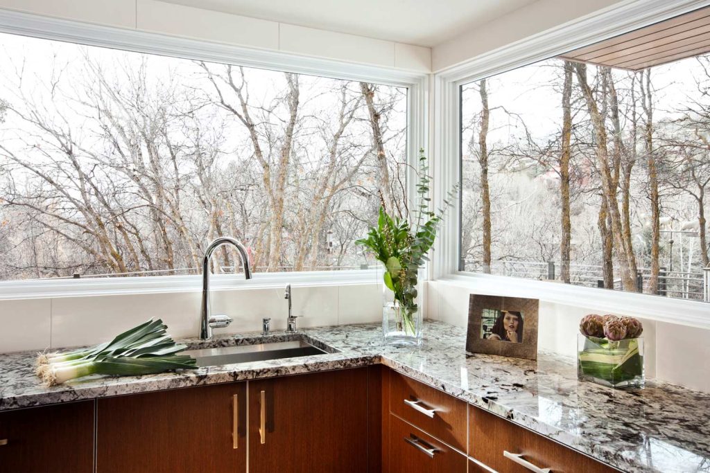 A luxury kitchen with glass walls