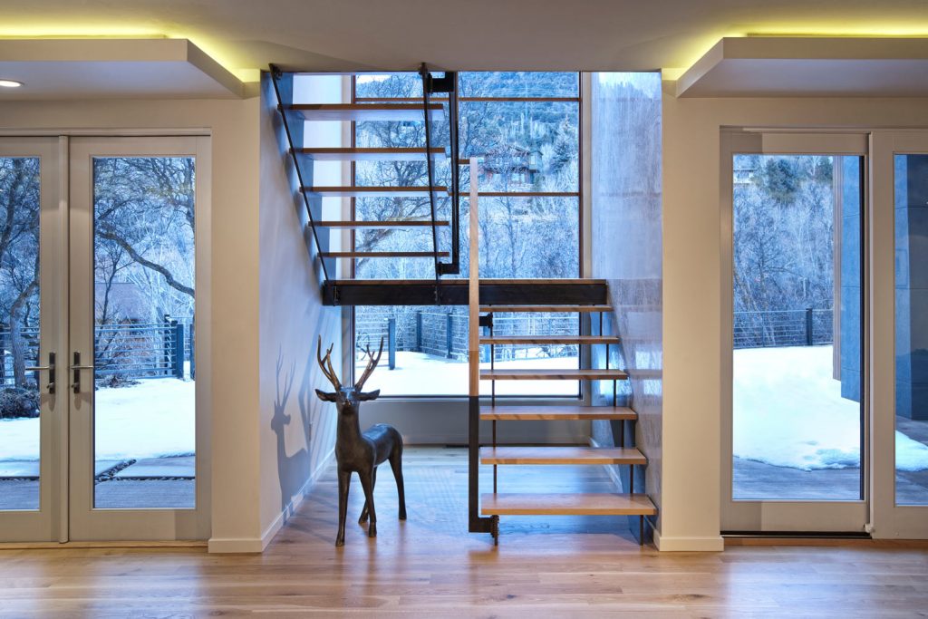 A two-level staircase with a statue of a deer