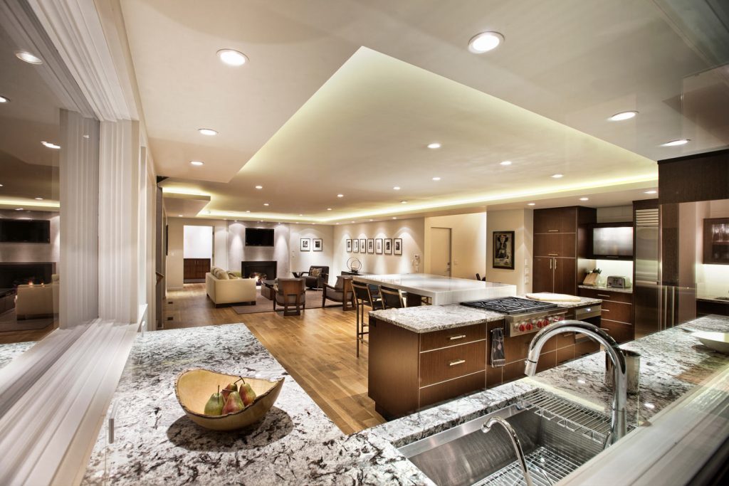 An open floor plan of a kitchen, dining and living room area