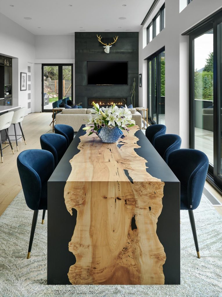 A waterfall dining room table and seating