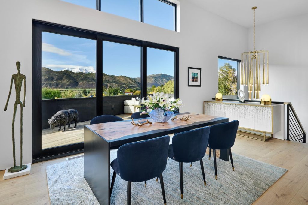 A waterfall dining room table and seating