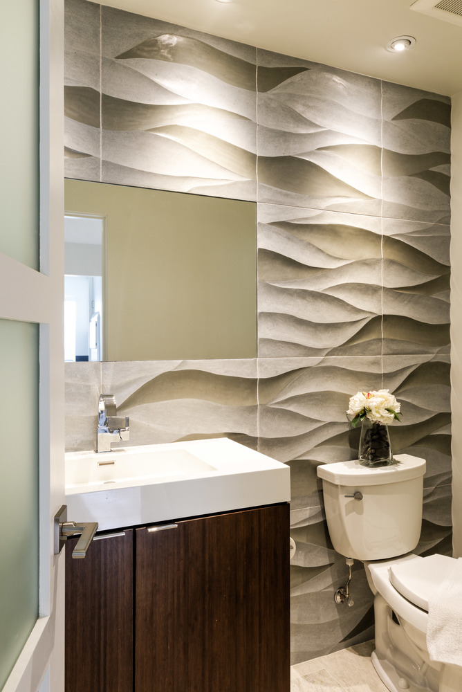 A luxury bathroom with a custom accent wall