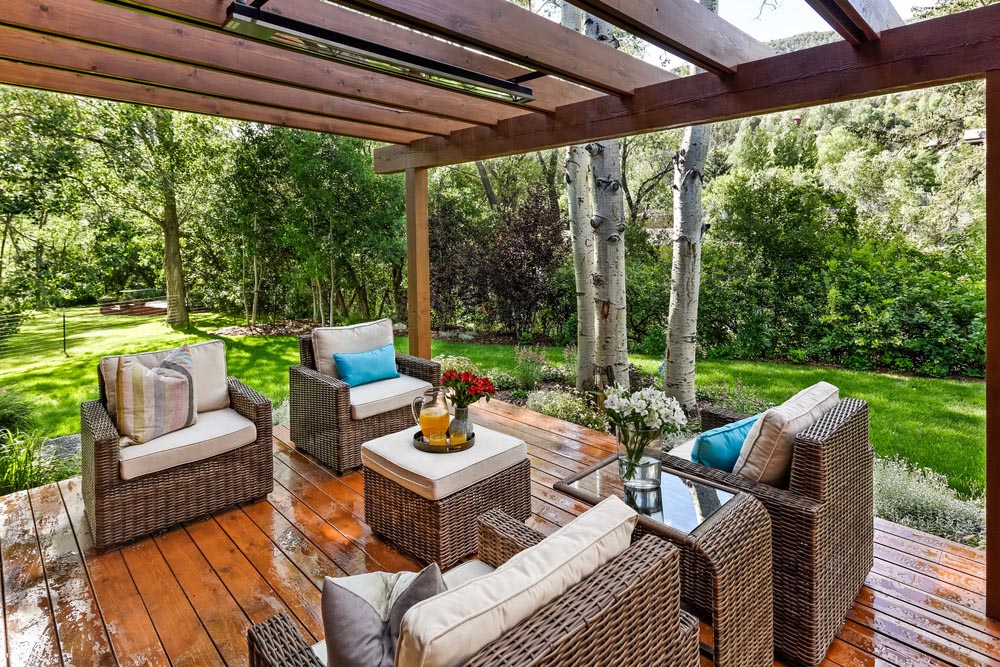 The back patio of a home with outdoor seating