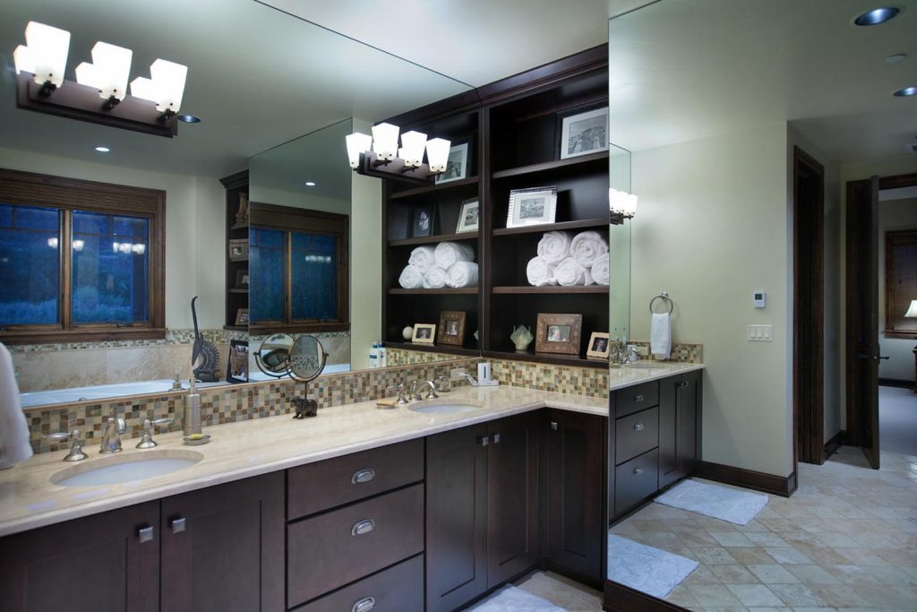 A luxury bathroom with a double-sink vanity and custom cabinetry