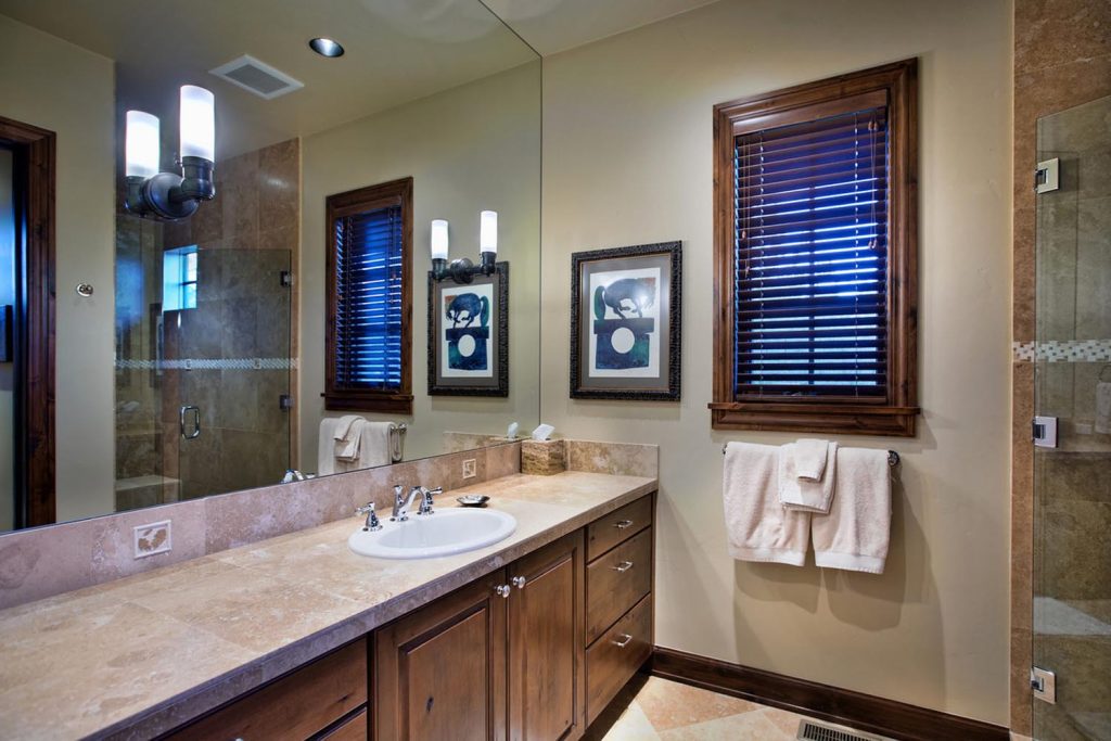 A custom bathroom with a glass shower