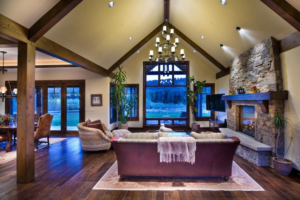 A rustic luxury living room with a vaulted ceiling