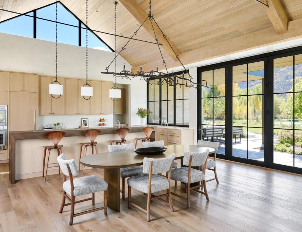 A beautiful cottage kitchen, dining area with an outdoor kitchen on the back porch