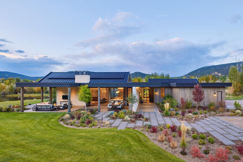 A modern luxury home with an outdoor kitchen