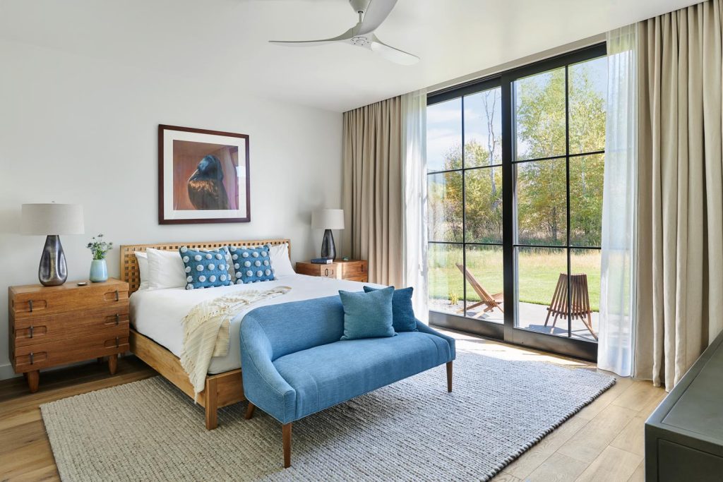 A luxury master bedroom with its own patio