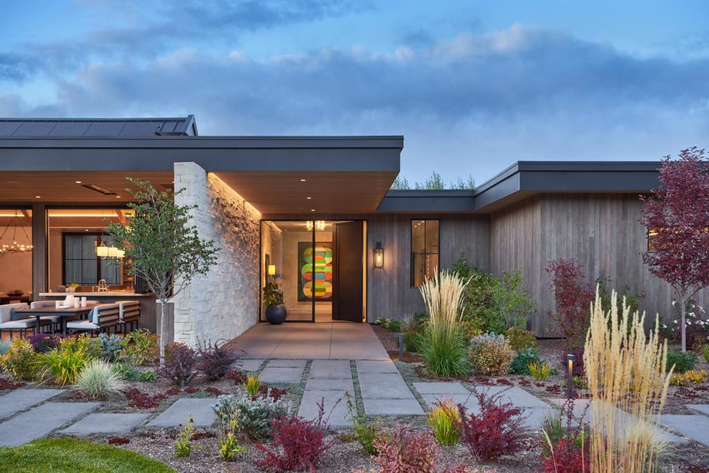 A modern luxury home with an outdoor kitchen