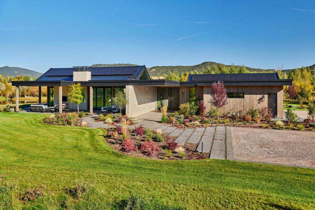The front entryway of a custom cottage and its front porch