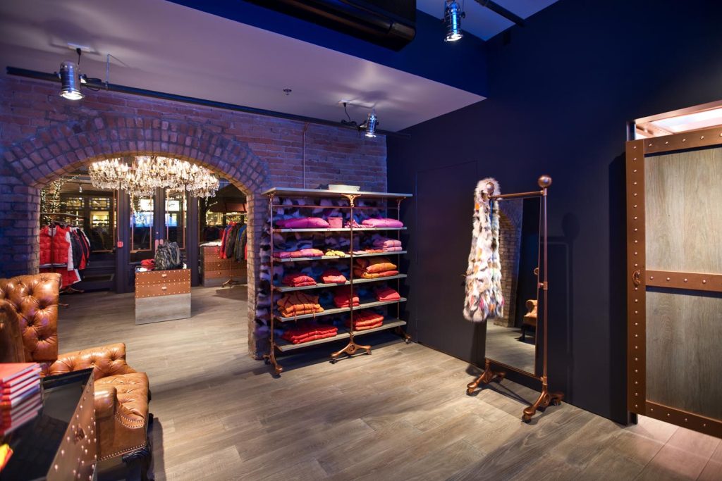 A boutique with moody lighting and custom changing rooms