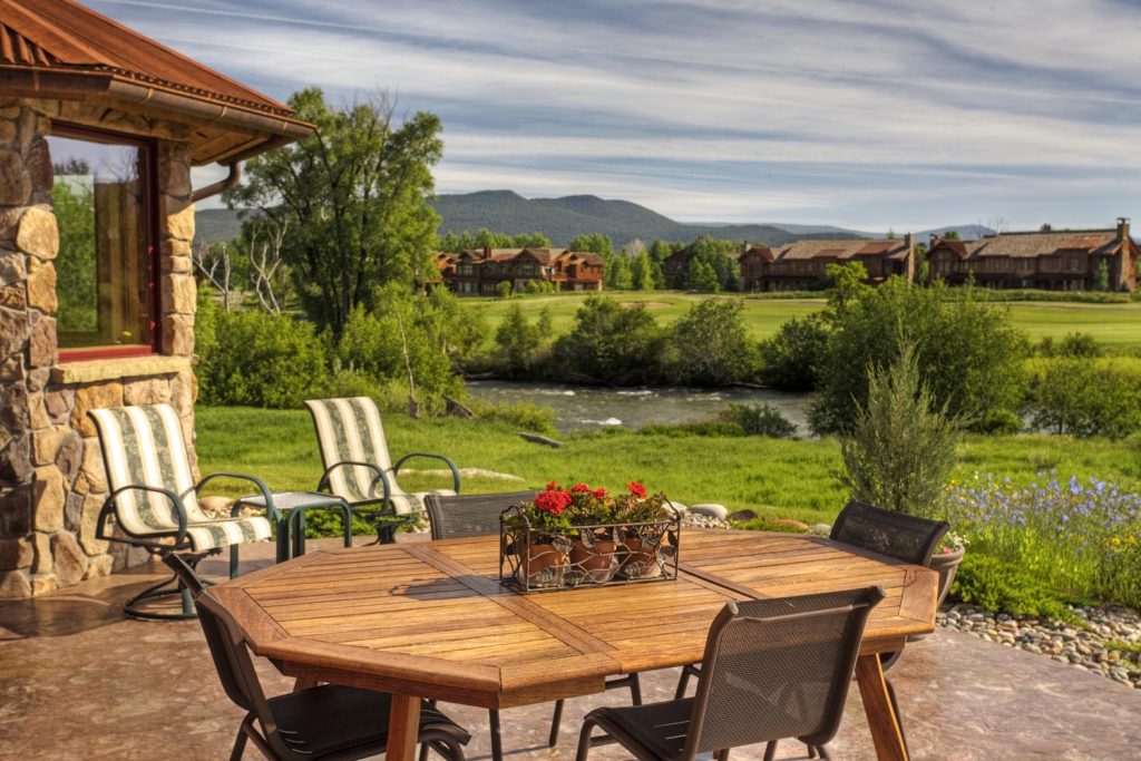 The exterior of a luxury home and its patio