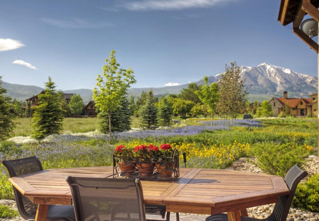 The exterior of a luxury home and its patio