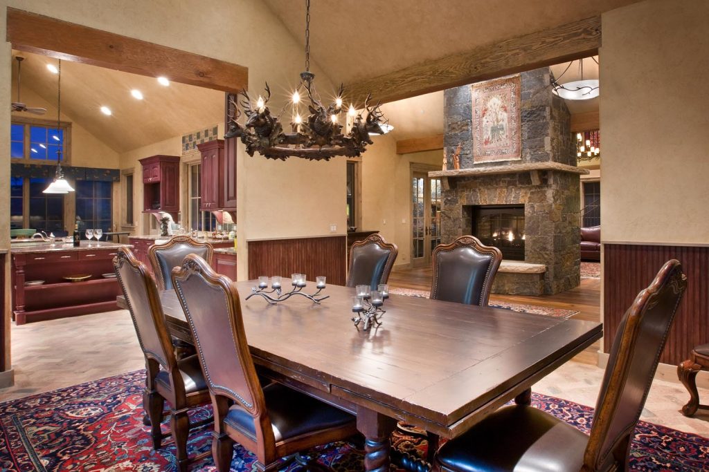 A warm rose-colored wood kitchen and dining room