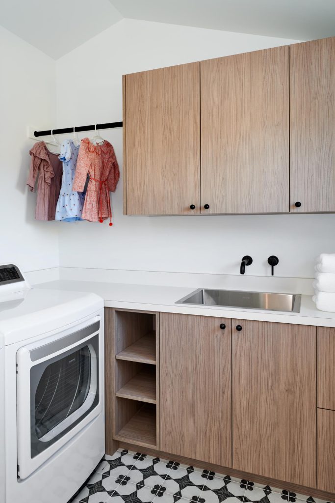 The laundry room with custom cabinetry