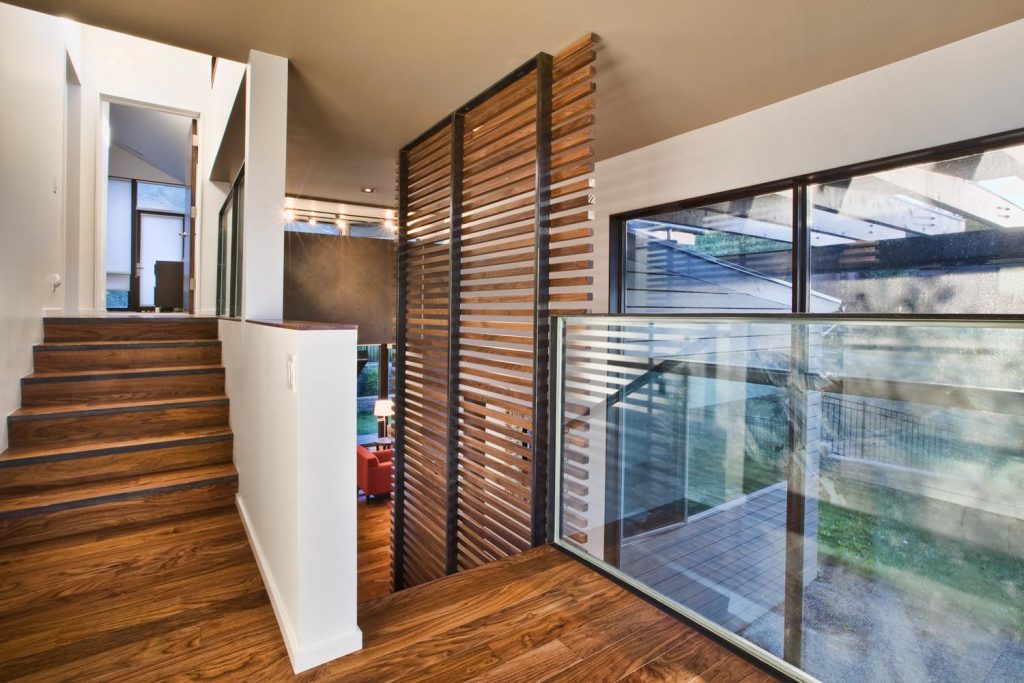 A luxury staircase with wood paneling