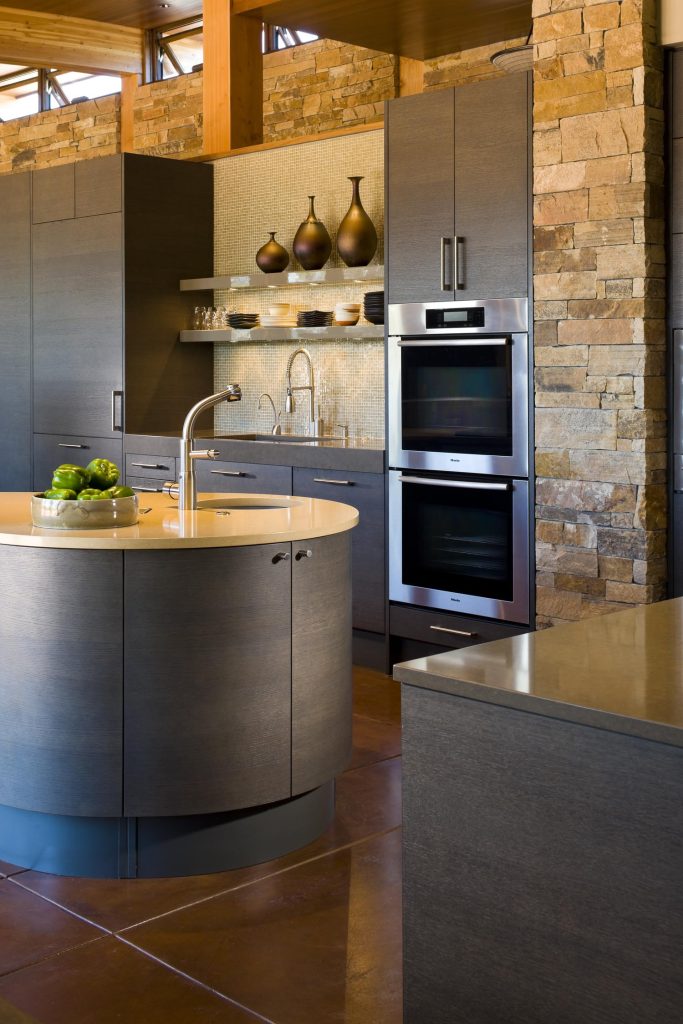 A custom kitchen with a sink set into the island