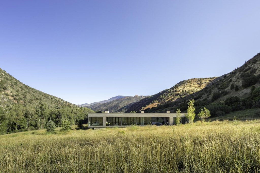 A hillside view of a luxury home