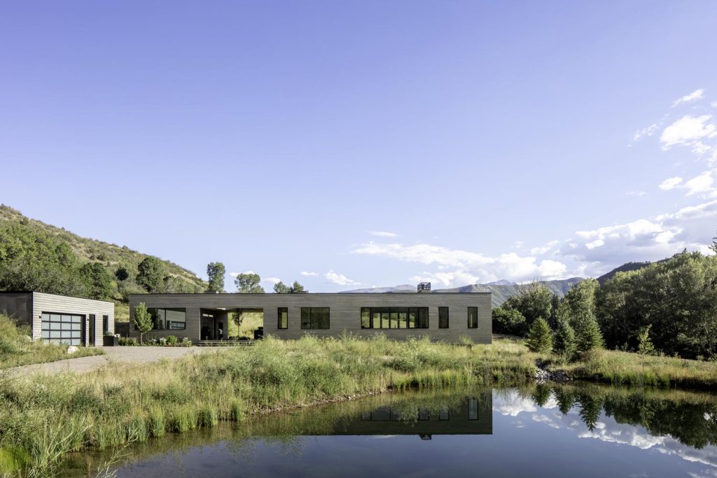 A waterfront view of a luxury home