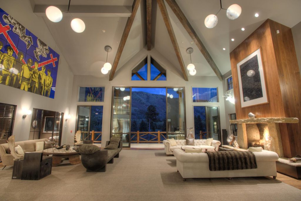 A vaulted ceiling and built-in fireplace provide an airy, luxury feel to this living room