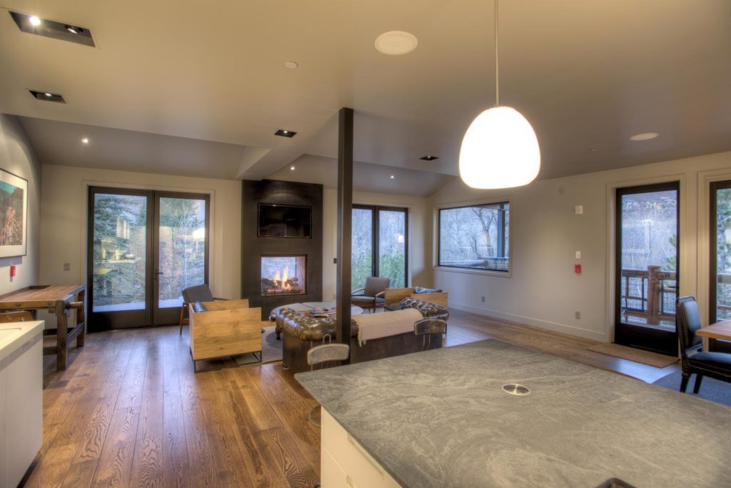 A cabin open floor plan with a built-in fireplace