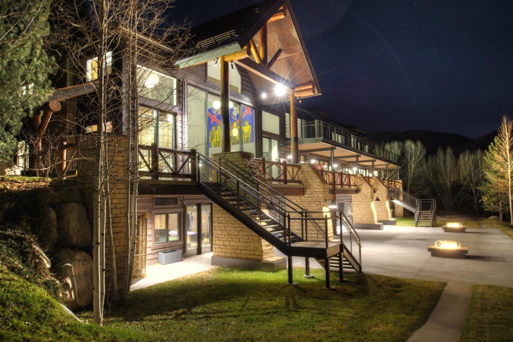 An outdoor luxury home with extensive stairs and balconies