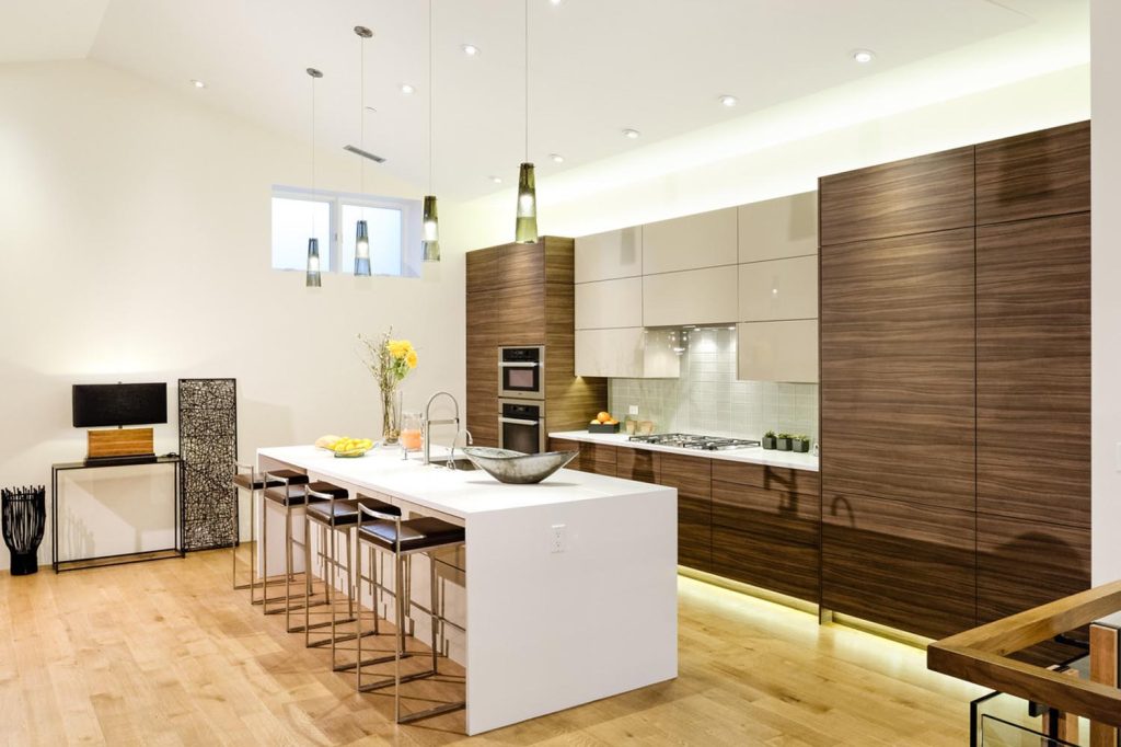 Luxury kitchen with wooden cabinetry and a white waterfall island