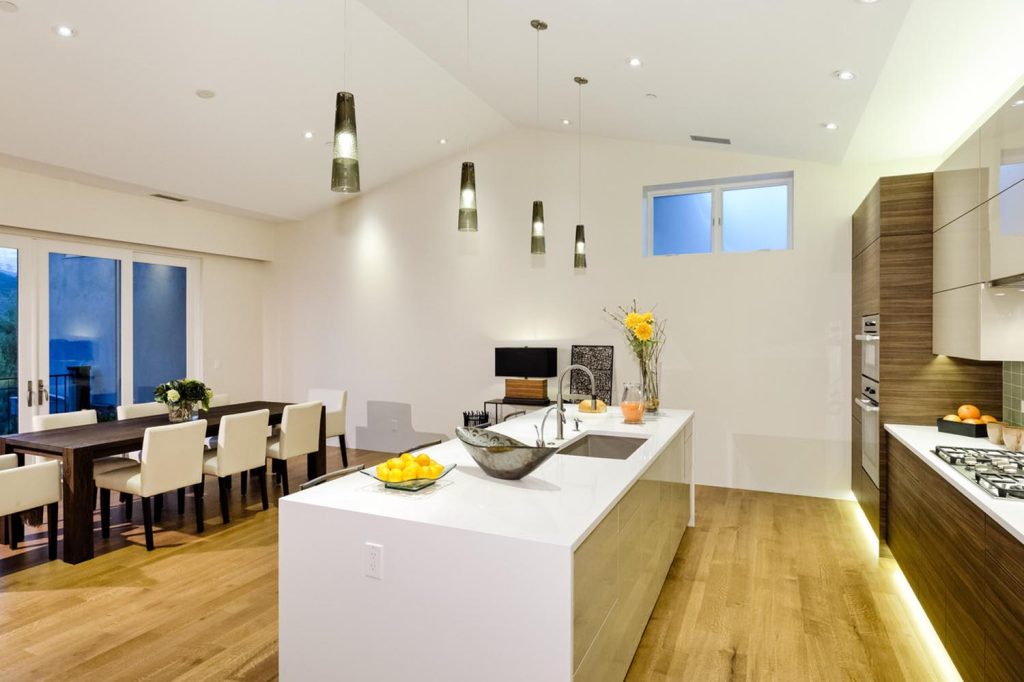 A luxury kitchen island and dining room space