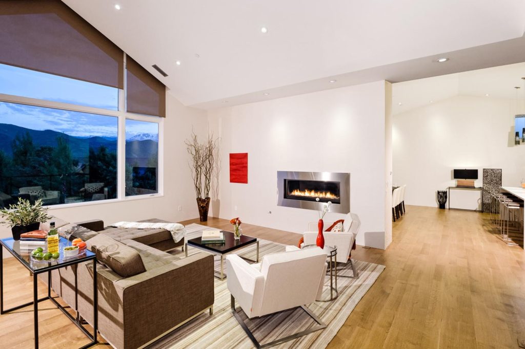 An open floor plan living room leading into the dining area