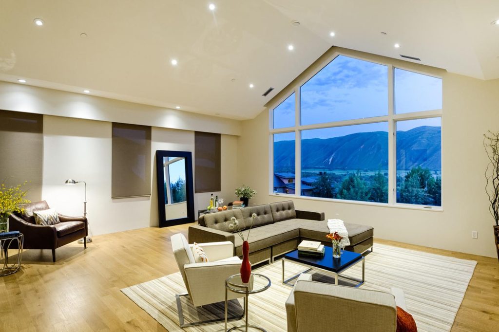 A large open living room with a vaulted ceiling