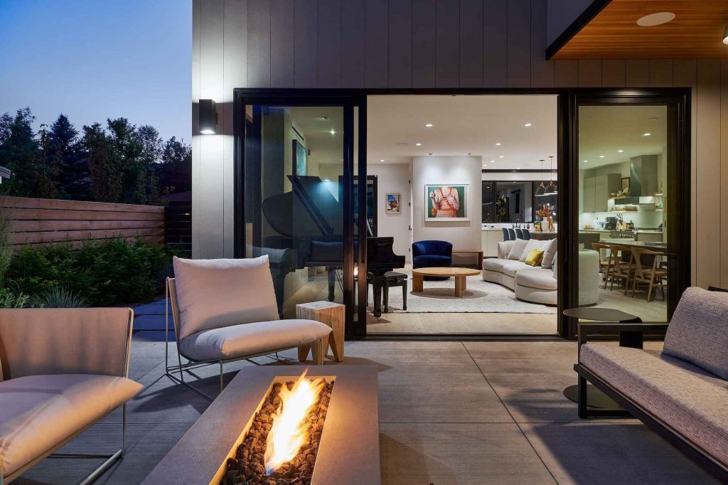 A bespoke outdoor patio with a fireplace